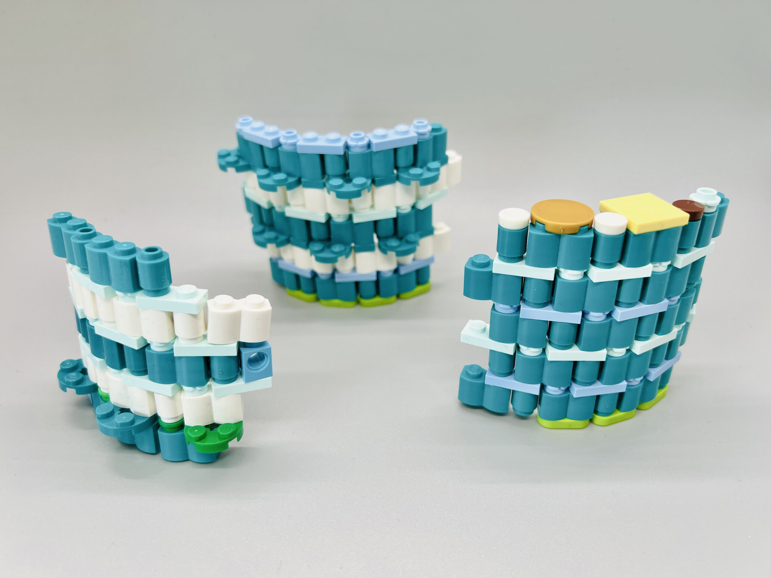 Dark turquoise hoops made of repeating 2x1 palisade bricks and 1x1 round plates.