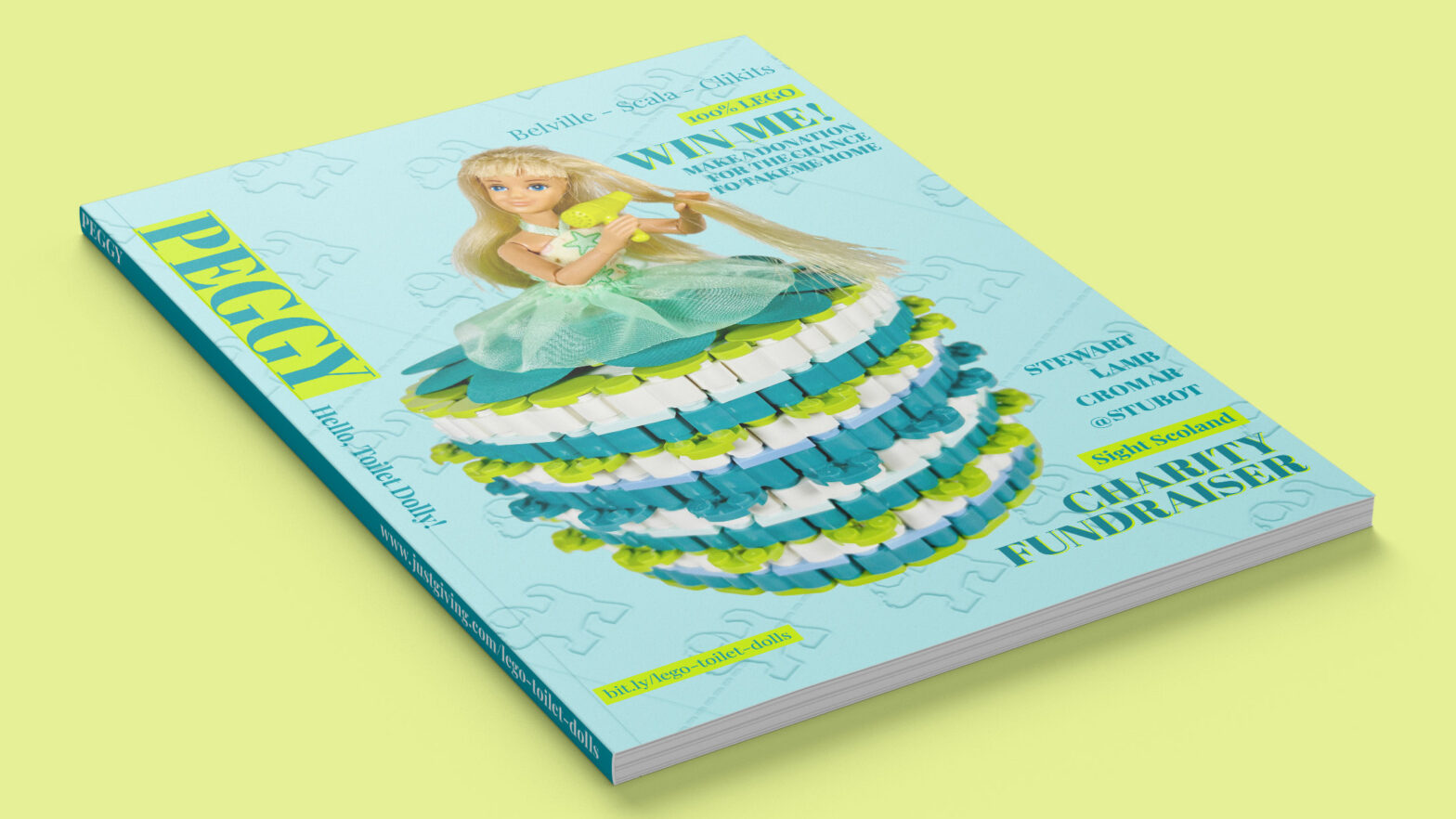 Mocked-up ‘Peggy’ magazine cover featuring a blonde doll drying her hair. She’s wearing a white, lime and dark turquoise coloured brick-built toilet roll dress.