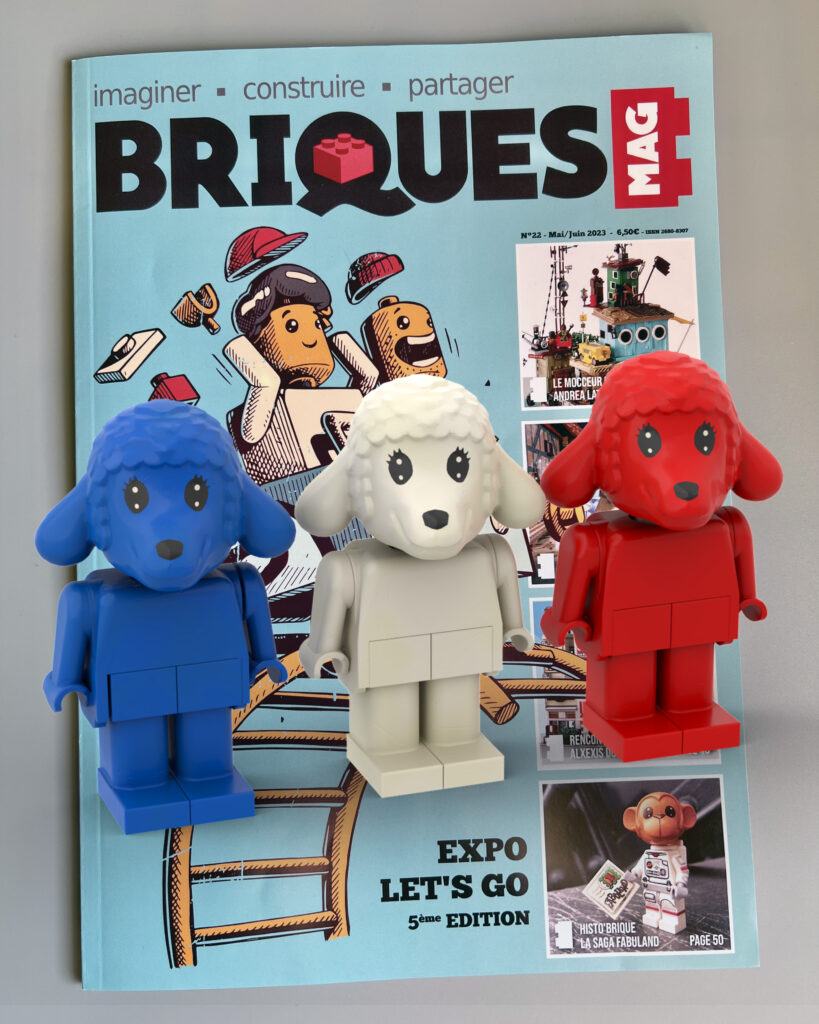 Three Lego lambs (blue, white & red) and new Briques magazine cover.