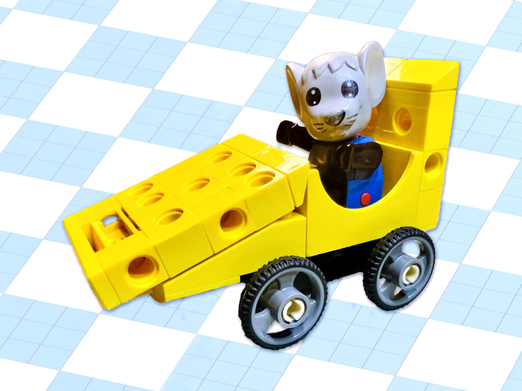 Grey mouse driving a yellow speedster made of Emmental.