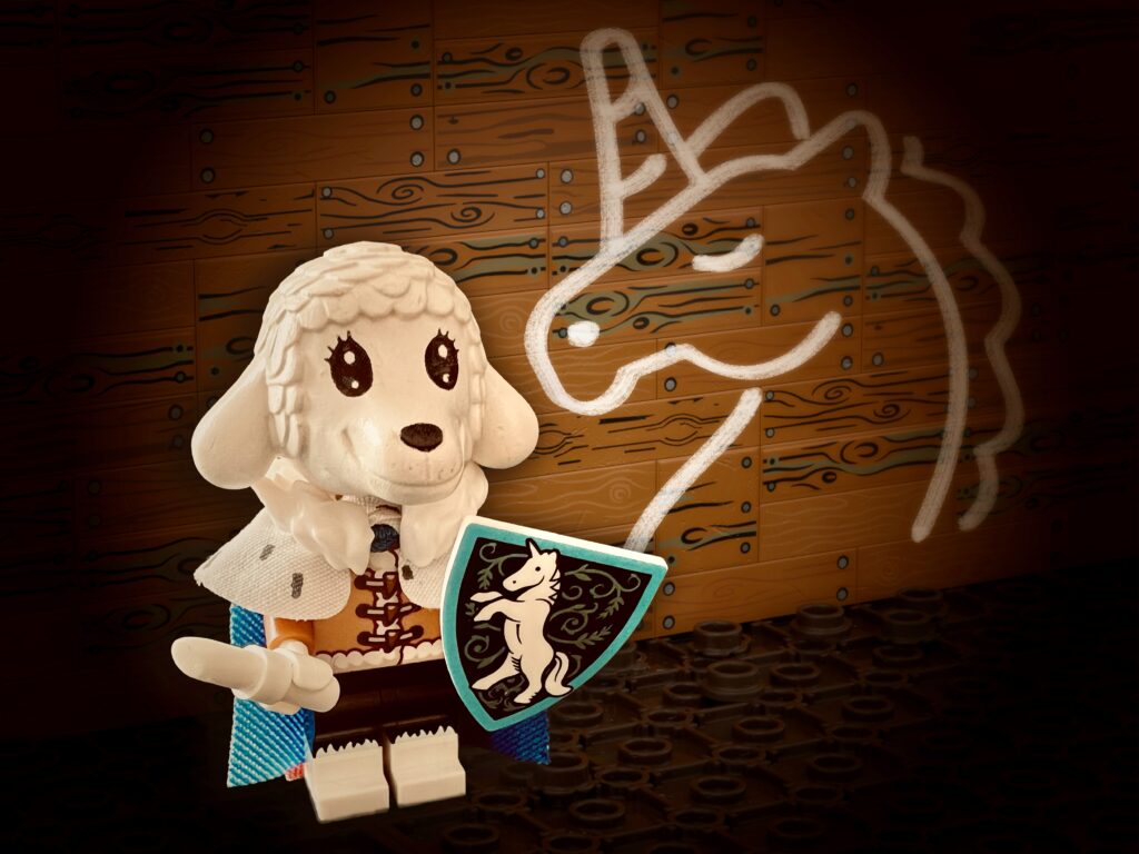 Robed lamb Minifigure holding her ornate shield and white chalk, standing proudly in front of her unicorn doodle.