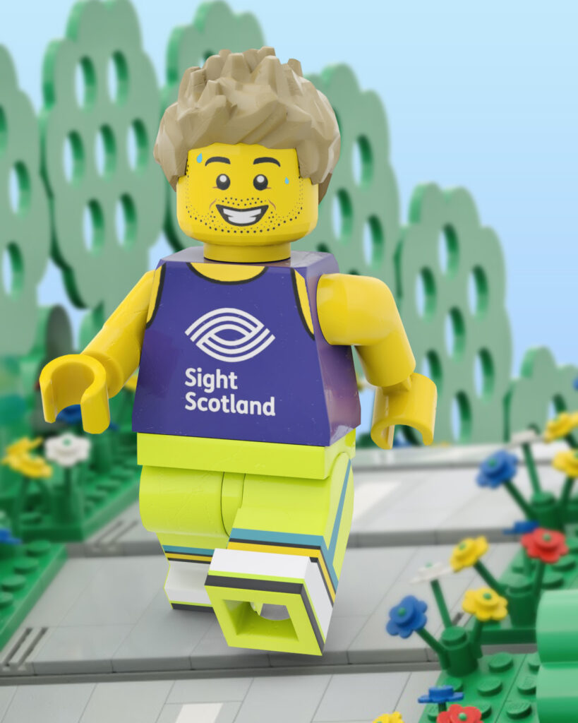 Peter’s Minifigure wearing a Sight Scotland vest, running on a road.